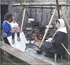 Cooking a chicken stew over an open fire