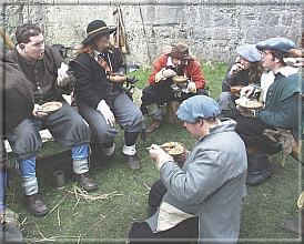 Gulping down a few mouthfulls of food during a lull in the fighting