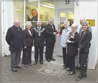 Hon. J. A. Brown SHK, MHK for Castletown performed the opening ceremony for the newly extended Hospice Shop at 9, Arbory Street, Castletown on Friday 24th January 2003. Those attending included the Chairman of Castletown Commissioners and Mrs Cringle, President of Hospice, Mrs Nadene Crowther, Mr P. G. Collier, General Manager of Hospice and Mr Vickers, Chairman of Share the Care Ltd., together with other Directors. 