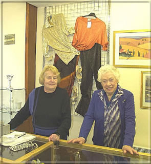Volunteers Ann Farimond and Hazel Cowley pause for the photographer in between serving a large crowd of customers