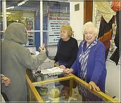 Hospice Shop Volunteers serving a customer
